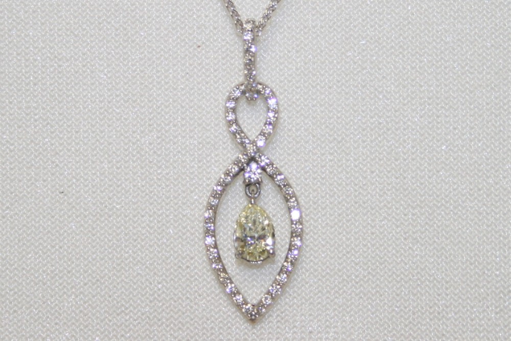 Diamond Pendant with Pear Shaped Diamond Dangle – 0.57ct.