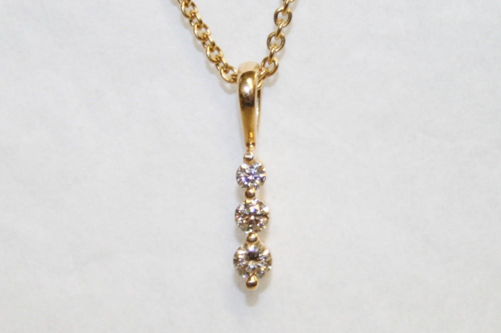 Yellow Gold Three Stone Diamond Pendant – 0.25ct tw